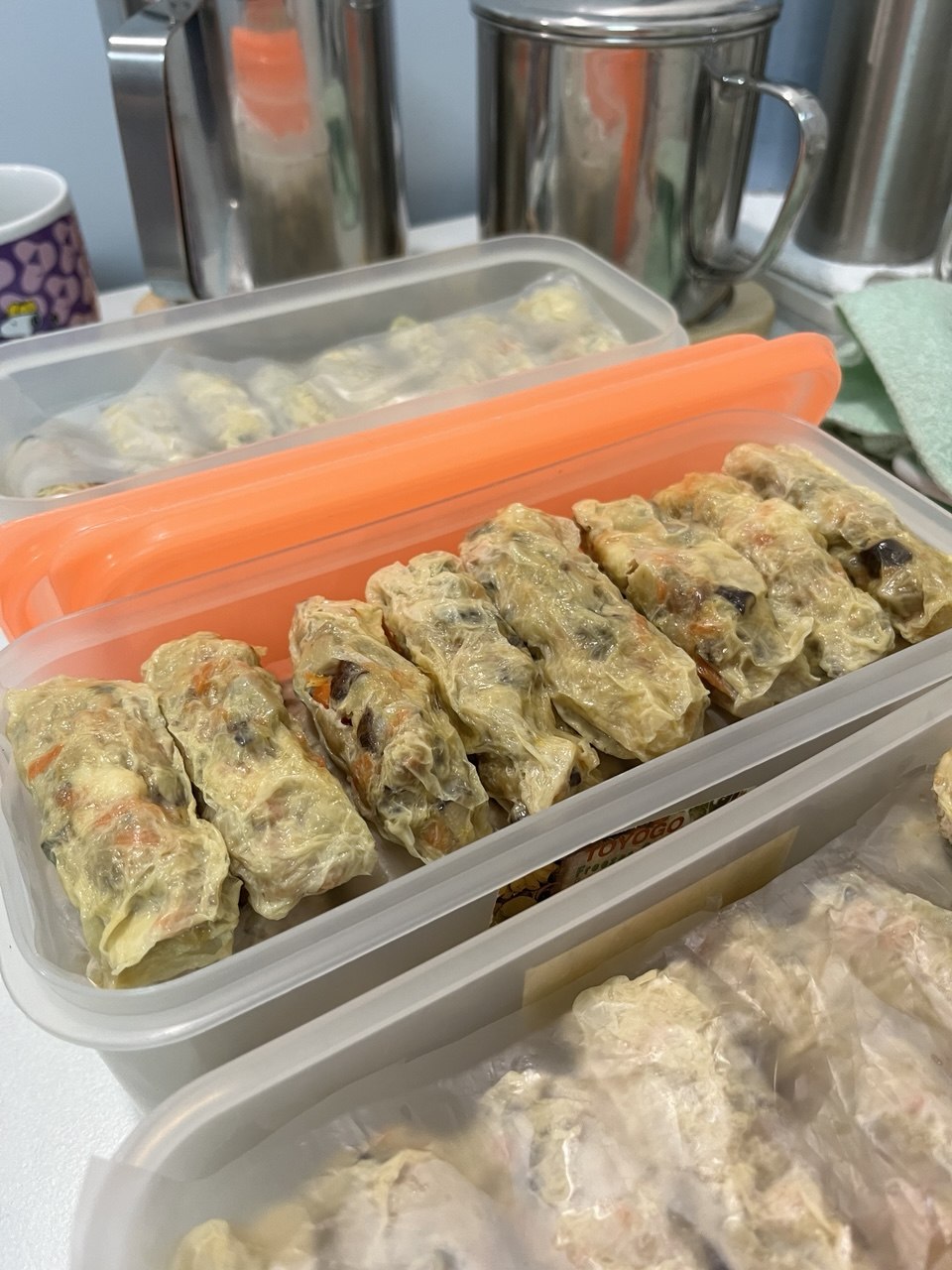 Ngoh hiang packed neatly into containers, ready to be split among the families to bring home.